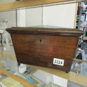 A Victorian Rosewood tea caddy (missing insides).