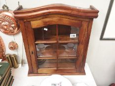 A mahogany collectors display cabinet