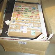 A box of assorted stamps, loose and in albums.