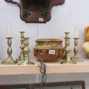 A mixed lot of old brass ware including candlesticks.