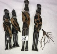 A set of 4 tribal figures.