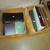 2 boxes of new and used stamp albums.