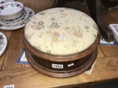 A Victorian round mahogany footstool