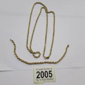 A long 9ct gold neck chain with matching bracelet (bracelet missing clasp), approximately 7 grams.