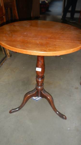 A late Victorian circular oak tip top table.