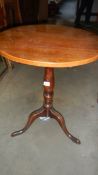 A late Victorian circular oak tip top table.