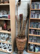 A bamboo planter and a quantity of bamboo