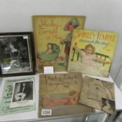 A collection of Shirley Temple memorabilia and other film items.