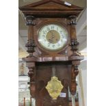 A mahogany wall clock.