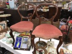 A pair of Victorian mahogany balloon back chairs