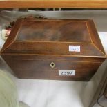 A Victorian mahogany tea caddy.