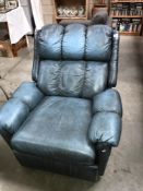 A blue leather reclining chair