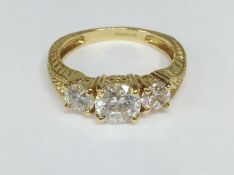 A 14ct gold ring set white stones, size T.