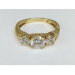 A 14ct gold ring set white stones, size T.