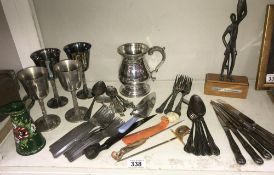 A quantity of cutlery, goblets, pewter tankard etc.