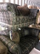 A pair of green and black paisley and striped upholstered 2 seat sofas