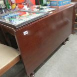 A Victorian mahogany drop leaf dining table.