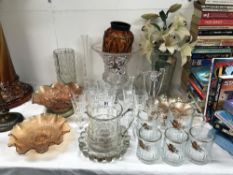 A large quantity of glassware including carnival glass bowls