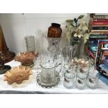 A large quantity of glassware including carnival glass bowls