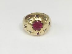 A 9ct gold ring set with 1ct ruby and diamonds (hall marked but indistinct) size J.