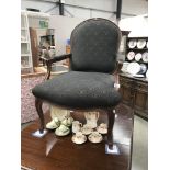 A darkwood stained wing arm chair