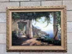 A framed print in ornate frame "View of the Amalfi coast" by C. F. Aagaard.