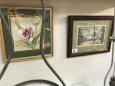 A watercolour of a woodland scene and a picture of an orchid