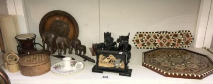 A quantity of carved wooden ornaments including an inlaid tray and ebony napin rings