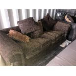 A black and brown paisley patterned upholstered 3 seat sofa with 5 matching cushions