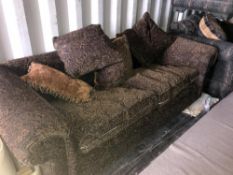 A black and brown paisley patterned upholstered 3 seat sofa with 5 matching cushions