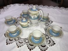 A Tokyo china coffee set with blue and white edges