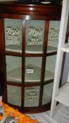 A glazed corner cabinet with 'Fry's' transfers.