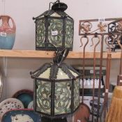 A pair of leaded glass lanterns.