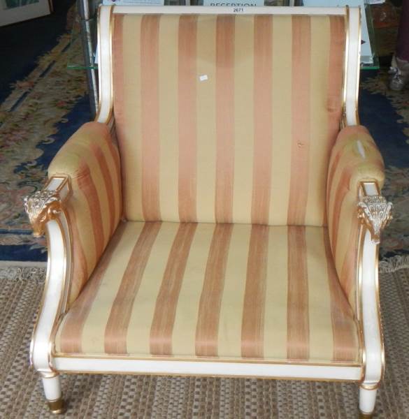A Regency style painted armchair with striped upholstery,