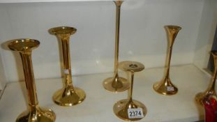 A collection of 6 Danish brass modernist candlesticks consisting of 2 graduated candlesticks by