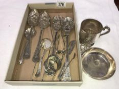 A tray of silver plate including sugar tongs, serving spoons etc.