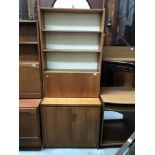 A wall unit book case and cabinet