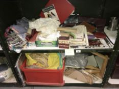 2 shelves of sewing craft items including fabric and vintage patterns etc.