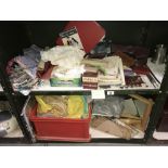 2 shelves of sewing craft items including fabric and vintage patterns etc.