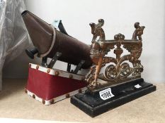 A Victorian bronze doorstop and copper bee smoker