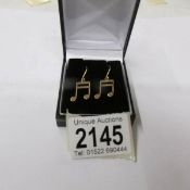 a pair of 9ct gold pendant earrings of quaver musical notes, hall marked.