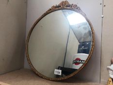 A gilt framed ormulu style mirror