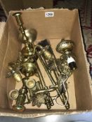 A box of brassware including Peerage candlesticks, wall lights etc.