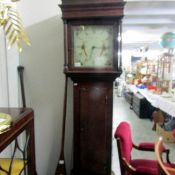 An oak cased Grandfather clock.