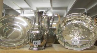 A ornate silver coffee pot, one other and 2 silver plate cake baskets.