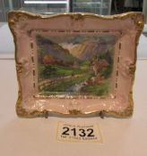 A Clarice Cliff ceramic pin dish with depiction of Alpine scene featuring a waterwheel by Royal