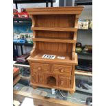 A small model of a pine dresser