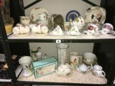 2 shelves of china including tea sets etc.