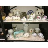 2 shelves of china including tea sets etc.