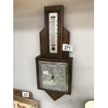 A 1930's oak aneroid barometer